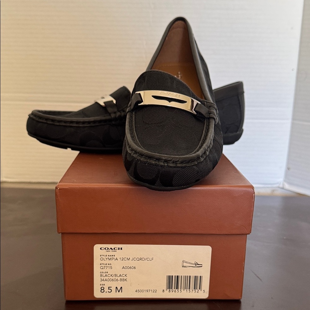 Coach Men's Black Slip-On Loafers with Silver Accent
